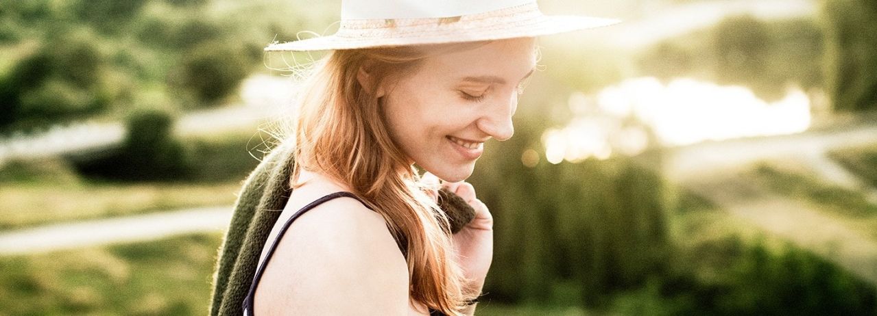 Girl wearing a hat and smiling