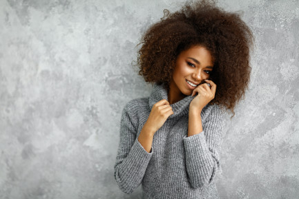 Woman wearing grey sweatshirt