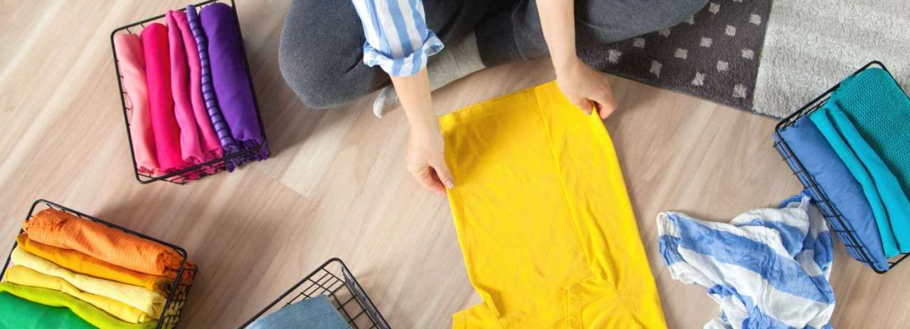 Person folding clothes